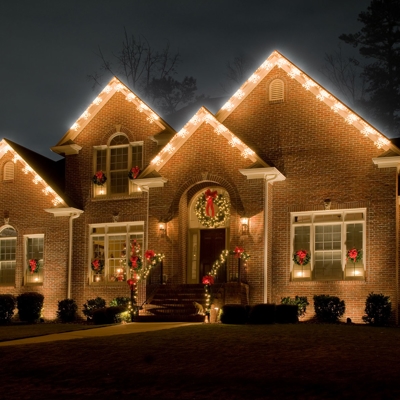 Roofline holiday lighting and wreaths transform this Cincinnati home for the holidays Photo